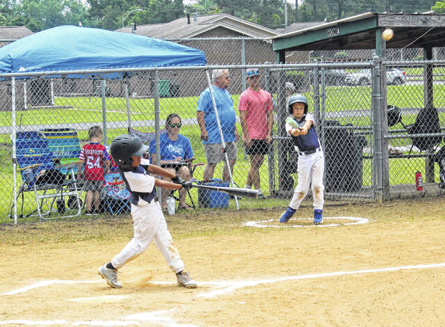 An Elizabethtown batter with a hit against Burgaw.
                                 Sonny Jones / Bladen Journal