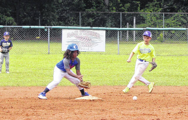 The Bladen County shortstop fields a ground ball and gets a force out at second base.
                                 Sonny Jones / Bladen Journal