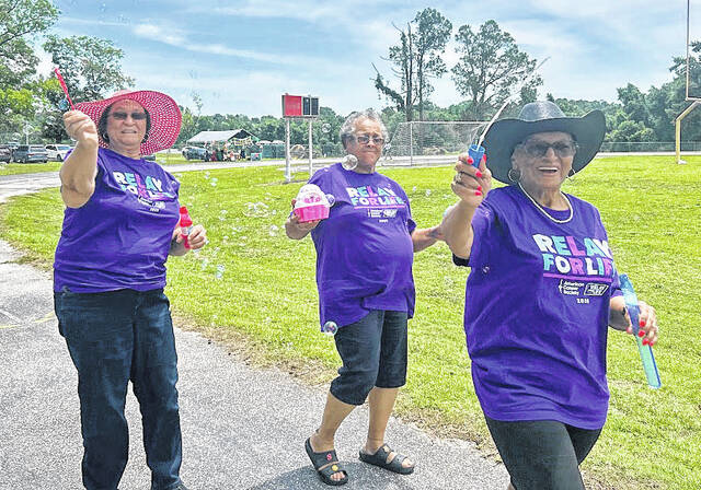 Relay For Life walkers release bubbles during the Survivors Lap Saturday, June 6 at Elizabethtown Middle School.
Lexie Tatum photo