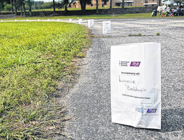 Illuminaria set along the track at Elizabethtown Middle School during the Relay For Life walk Saturday, June 6.
Lexie Tatum photo