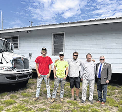 Bladen County manager Sam Croom (far right) is shown with the crew that moved the White Lake Friends new house onto its site on Thursday, June 4.
Contributed photo